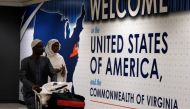 A file photo of International passengers arriving at Washington Dulles International Airport after the US Supreme Court granted parts of the Trump administration's emergency request to put its travel ban into effect later in the week pending further judic