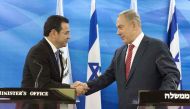 (FILES) This file picture taken on November 28, 2016 shows Guatemalan President Jimmy Morales (L) and Israeli Prime Minister Benjamin Netanyahu (R) shaking hands during a joint press conference after signing bilateral agreements at the Prime Minister's Of