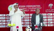 Qatar Football Association Sub-Leagues Committee member Khalid Al Rumaihi (left) picks a team during the draw ceremony.