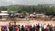 People attempt to rescue flood victims in Lanao Del Norte, Philippines, in this December 22, 2017 photo obtained from social media. Courtesy Aclimah Cabugatan Disumala via REUTERS.