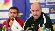 Qatar football coach Felix Sanchez (right) speaks while Qatar leftback Abdulkarim Al Ali looks on during a press conference ahead on the eve of their Gulf Cup match against Iraq yesterday. Pictures: Hussein Sayed