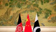 (L-R) Afghan, Chinese and Pakistani flags are placed at the lobby during the 1st China-Afghanistan-Pakistan Foreign Ministers' Dialogue in Beijing, China, December 26, 2017. REUTERS/Jason Lee