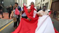 People hold a protest against Peruvian President Pedro Pablo Kuczynski's humanitarian pardon to Peru's jailed ex-president Alberto Fujimori, in Lima on December 25, 2017.  AFP / Juan Vita

