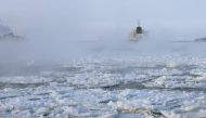 Cargo ships make their way down the ice-covered Saint Lawrence River December 28, 2017 at the Sorel-Tracy Ferry crossing in Sorel-Tracy, Quebec. / AFP / AFP PHOTO / Timothy A. CLARY