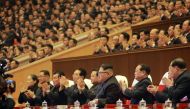 This picture from North Korea's official Korean Central News Agency (KCNA) taken on December 29, 2017 and released on December 30, 2017 shows North Korean leader Kim Jong-Un (front C) attending an art performance of chorus and the Moranbong band with part