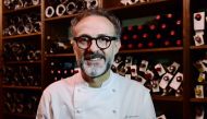 (FILES) This file photo taken on July 07, 2016 shows Italian chef Massimo Bottura posing in the kitchen of his restaurant 