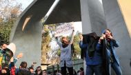 People gather to protest over the high cost of living in Tehran, Iran on December 30, 2017. Stringer - Anadolu 

