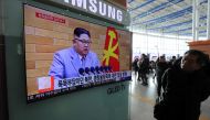 People watch a TV broadcasting a news report on North Korea's leader Kim Jong Un speaking during a New Year's Day speech, in Seoul, South Korea, January 1, 2018. Yonhap via Reuters