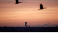File photo smoke rising from the Gaza Strip, after an Israeli strike in November. Amir Cohen / Reuters
