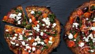Cauliflower Pizzas With Chard and Olives. Photo by Deb Lindsey for The Washington Post.