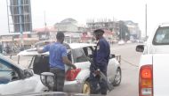 A security person checks a car in Kinshasa, Democratic Republic of Congo December 31, 2017. REUTERS/Kenny Katombe.