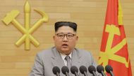 A picture North Korean leader Kim Jong-Un delivering a New Year's speech at an undisclosed location January 1, 2018. AFP PHOTO/KCNA VIA KNS