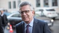 German Interior Minister Thomas de Maiziere arrives to attend consultations between the conservative CDU/CSU and the social democratic SPD parties on January 3, 2018 in Berlin. AFP / dpa / Michael Kappeler