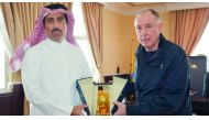 Al Gharafa SC President Sheikh Jassim bin Thamer Al Thani presenting a memento to former coach Jean Fernandez.