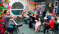Local Moroccan children attend a music class at the Stars Cultural Centre in Casablanca's northeastern suburb of Sidi Moumen on November 24, 2017. Based in a white building next to a tramline and opposite a mosque, the Stars Cultural Centre regularly host