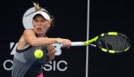 Caroline Wozniacki of Denmark hits a return against Sachia Vickery of the US during their women's singles semi-final match at the WTA Auckland Classic tennis tournament in Auckland on January 6, 2018. / AFP / MICHAEL BRADLEY.
