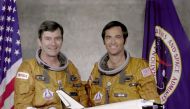 A file photo of STS-1 crew members Commander John Young (L) and Pilot Robert Crippen pose with a model of the Space Shuttle Columbia at Johnson Space Center in Houston May, 7, 1979. NASA/Handout via REUTERS/File Photo