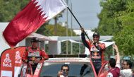 Toyota's Qatari driver Nasser Al-Attiyah (R) and co-driver French pilot Mathieu Baumel are pictured at the podium during the start of the 2018 Dakar Rally, ahead of the rally's Lima-Pisco Stage 1, in Lima on January 6, 2018. AFP / CRIS BOURONCLE
