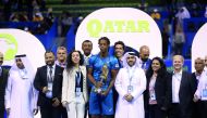 Qatar ExxonMobil Open champion Gael Monfils of France is seen with Qatar Tennis Federation officials and members of the organizing committee following the final staged at Khalifa Tennis and Squash Complex in Doha on Saturday night. 