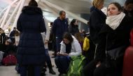 Passengers with their luggage are seen during the weather-related cancellation at the John F. Kennedy Airport in New York, United States on January 08, 2017. Mohammed Elshamy - Anadolu Agency