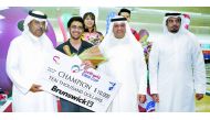 Jassim Mohammed Al Muraikhi of Qatar, winner in the Emir Cup 2017, poses for a picture along with the winner’s cheque and bowling officials in this March 2016 file picture at the Qatar Bowling Center in Doha. 