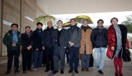 (L-R) Pro-democracy activists Raphael Wong, Lee Wing-tat, Cheung Sau-yin, Chu Yiu-ming, Benny Tai, Chan Kin-man, Shiu Ka-chun, Chung Yiu-wa and Tanya Chan pose outside a court after a pre-trial hearing in Hong Kong, China January 9, 2018. REUTERS/Bobby Yi