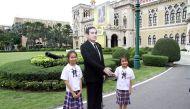 Children pose next to a cardboard cut-out of Thailand's Prime Minster Prayuth Chan-ocha at the government house in Bangkok, Thailand January 8, 2018. Picture taken January 8, 2018. Dailynews via REUTERS