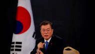 South Korean President Moon Jae-in answers reporters' question during his New Year news conference at the Presidential Blue House in Seoul on January 10, 2018. AFP / POOL / KIM HONG-JI
