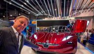 Henrik Fisker, founder, Chairman and CEO of Fisker Inc., speaks next to a Fisker EMotion all-electric vehicle that uses LiDAR technology at CES in Las Vegas, Nevada, January 9, 2018. / AFP / DAVID MCNEW
