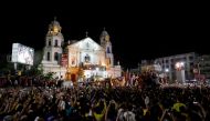 Devotees flock as a carriage bearing a Black Nazarene image makes its way back to Quiapo church, after a day-long annual religious procession in Manila, Philippines January 10, 2018. REUTERS/Dondi Tawatao