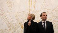 French President Emmanuel Macron (R) and his wife Brigitte Macron (L) visit the Ullens Chinese Contemporary Art Centre in Beijing January 9, 2018. Picture taken January 9, 2018. Reuters/Ludovic Marin