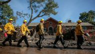 Rescue workers enter properties to look for missing persons after a mudslide in Montecito, California, U.S. January 12, 2018. REUTERS/ Kyle Grillot
