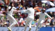 India's bowler Ravichandran Ashwin (L) celebrates the dismissal of South Africa's Aiden Markram (not in picture) during the first day of the second Test cricket match between South Africa and India at Supersport cricket ground on January 13, 2018 in Centu