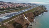 A Pegasus Airlines Boing 737 passenger plane is seen struck in mud on an embankment, a day after skidding off the airstrip, after landing at Trabzon's airport on the Black Sea coast on January 14, 2018. (AFP / IHLAS NEWS AGENCY )
