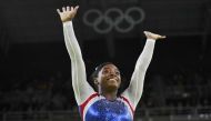 File photo of Simone Biles of USA celebrates winning gold in the women's gymnastics individual all-around final. REUTERS/Dylan Martinez
