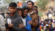Rohingya refugees line up for daily essentials distribution at Balukhali camp, near Cox's Bazar, Bangladesh January 15, 2018. REUTERS/Tyrone Siu
