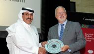 The Governor of Qatar Central Bank H E Sheikh Abdulla bin Saoud Al Thani (left), receiving a memento from the Dean of Carnegie Mellon University in Qatar (CMU-Q), Michael Trick, after the Governor delivered a lecture as part of the Dean’s Lecture Series o