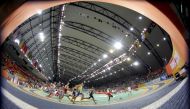 Runners compete in the men’s heptathlon 1000 meters race at the 2010 IAAF World Indoor Athletics Championships at the Aspire Dome in this file picture.