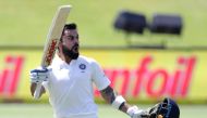 File photo of India's captain Virat Kohli raising his bat and helmet as he celebrates scoring a century (100 runs) during the third day of the second Test cricket match between South Africa and India at Supersport cricket ground on January 15, 2018 in Cen