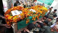 Indian Border Security Force (BSF) officers carry the coffin of slain Head Constable A Suresh during a wreath-laying ceremony at the BSF headquarters in Jammu on January 18, 2018.   AFP