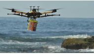 Along with spotting swimmers in trouble and dropping lifesaving devices to them, the drones are being used to spot predators such as sharks (Photo: AFP/PETER PARKS)
