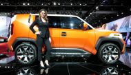 Product Specialist Ally Kay poses next to a Toyota 4X concept vehicle during Press Days of the North American International Auto Show at Cobo Center in Detroit, Michigan, U.S., January 16, 2018. Reuters/Rebecca Cook