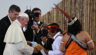 Pope Francis is greeted by members of an indigenous group from the Amazon region during a meeting at the Coliseo Regional Madre de Dios in Puerto Maldonado, Peru, January 19, 2018. Reuters/Alessandro Bianchi