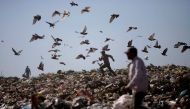 A man runs at 'Lixao da Estrutural', Latin America's largest rubbish dump, in Brasilia, Brazil, January 19, 2018. REUTERS/Ueslei Marcelino