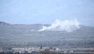 The photo taken from Turkey's Kilis province shows smoke rising as Turkish army hit PYD/PKK terror group's shelters 