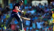 England batsman Jos Buttler jumps for joy as he reaches his century during the third one-day international (ODI) cricket match between England and Australia in Sydney on January 21, 2018.  (AFP / Glenn Nicholls )