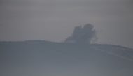 A photo taken from Turkey's Hatay shows smokes rising as Turkish military aircrafts continue to hit PYD/PKK terror group targets within the 'Operation Olive Branch' launched in Syria's Afrin, on January 21, 2018 in Hatay, Turkey. Cem Genco - Anadolu 
