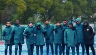 Qatar under-23 football players pose for a photograph following a training session in Changzhou, China yesterday. 