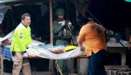 Thai rescue workers carry the body of a victim killed in a bomb explosion at Pimolchai fresh food market in the city of Yala, in the Muslim-majority province of Yala, southern Thailand, 22 January 2018. EPA/NAKHARIN CHINNAWORNKOMOL