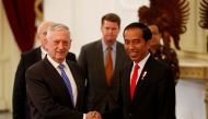 US Secretary of Defence Jim Mattis (L) shakes hands with Indonesia's President Joko Widodo during his visit to the presidential palace in Jakarta, Indonesia January 23, 2018. REUTERS/Darren Whiteside